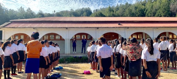 Nico and Ana giving oral hygiene instruction to school kids